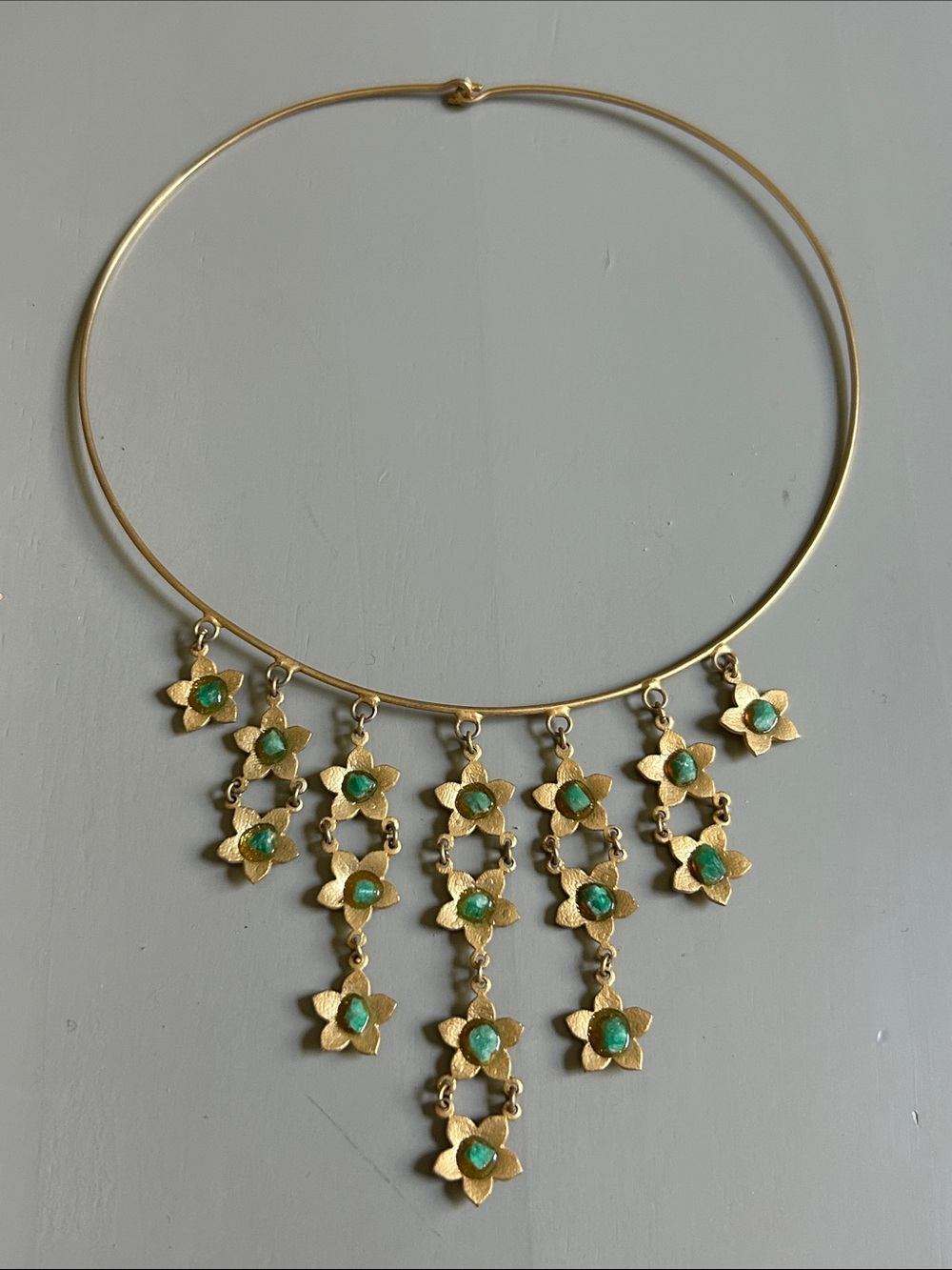 Gold choker with dangling gold tone flowers